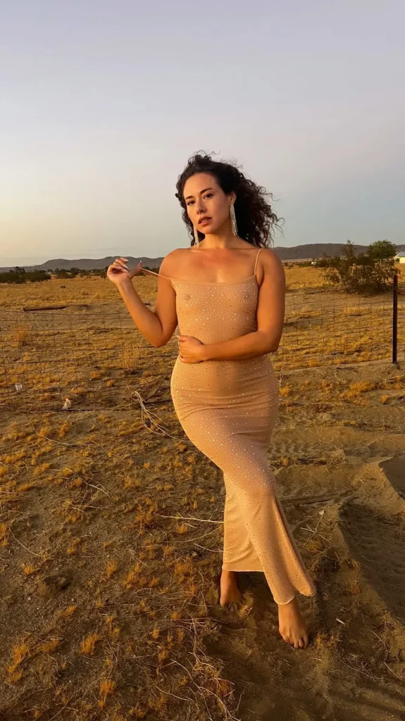 Dora Madison Burge showing boobs in a sheer dress