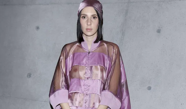 Italian model wearing a see through jacket and no bra