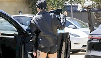 Lady Gaga exits a car wearing tight black shorts
